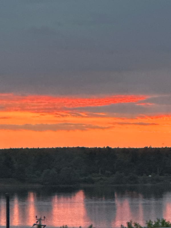 Dramatic sunset illuminates Chaikovsky, Russia over Kama River