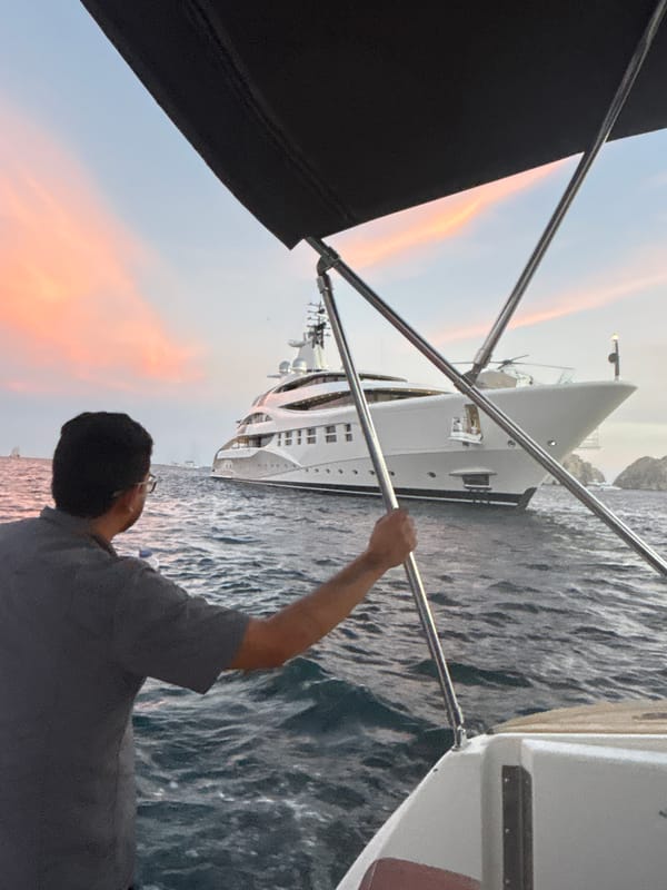 Luxury yachts spotted in Cabo San Lucas harbor at sunset