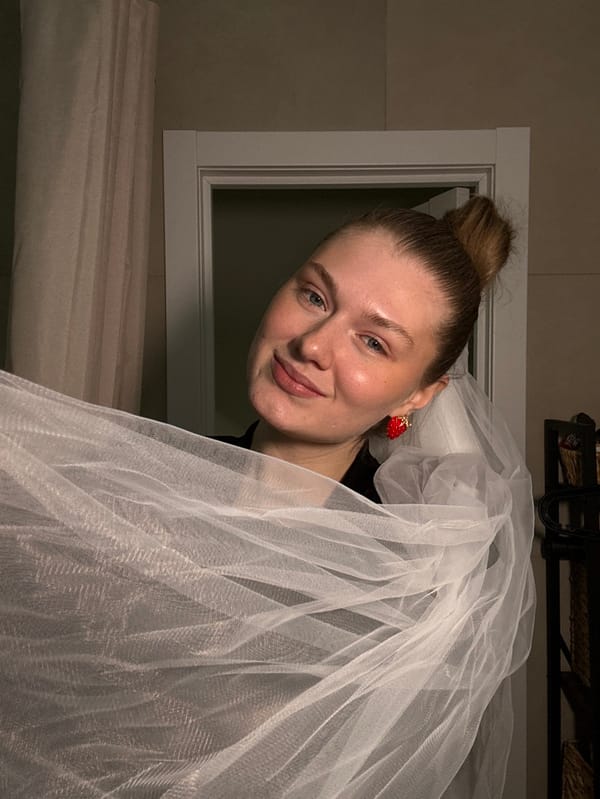 Woman photographs selfie session with strawberry earrings in Kazan