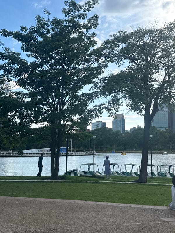 Bangkok park morning meets nearby robotics exhibition