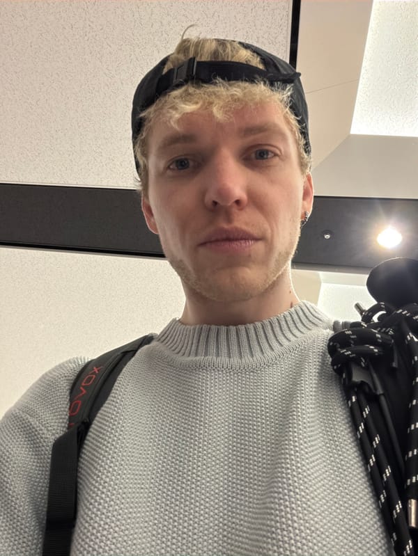 Travelers navigate busy New Chitose Airport during morning hours