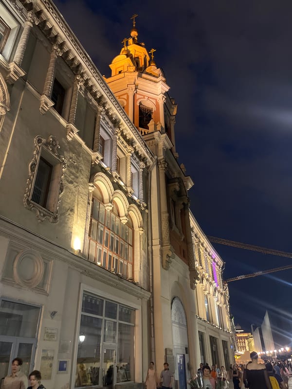 Classical Moscow building facade lit up at night
