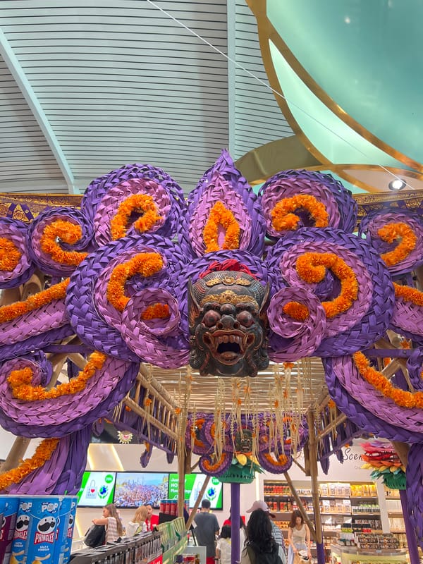Bali airport departure area decked in vivid Balinese decor