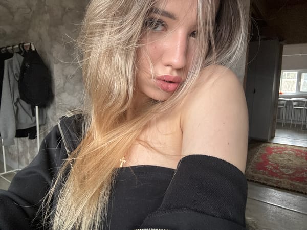 Woman photographed multiple times in Noviy, Russia indoor setting