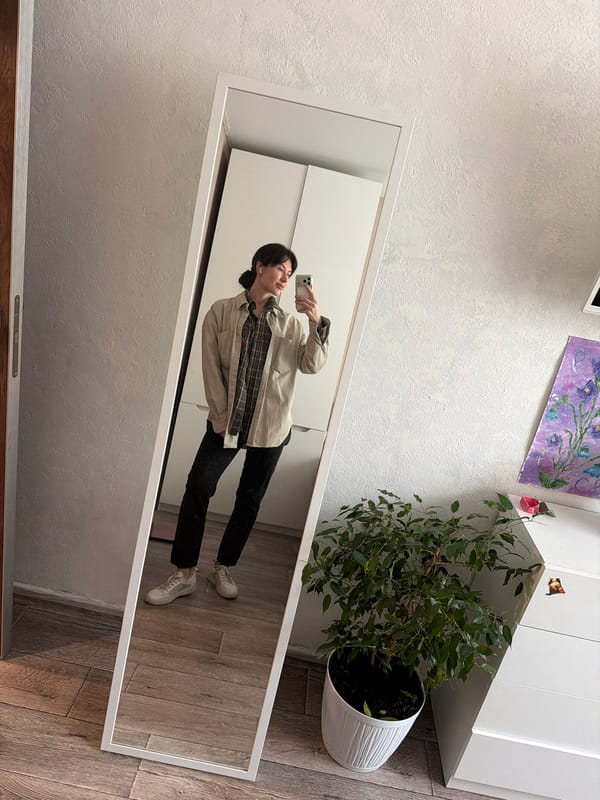 Woman takes morning mirror selfies in Perm apartment