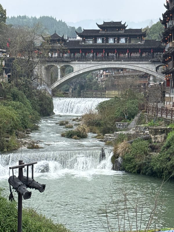 Morning tour captures Furong Ancient Town's waterfall and traditional life