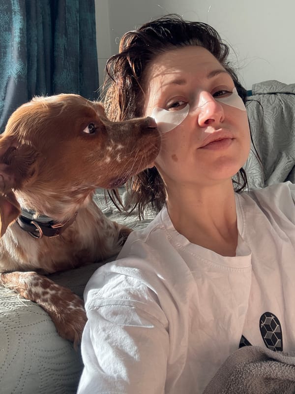 Woman enjoys morning skincare routine with dog companion in Sofia