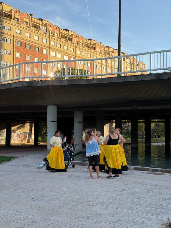 Traditional folk dancers perform with containers across Valencia parks