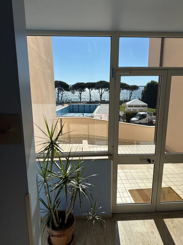 Morning lake view captured from building window in Bracciano