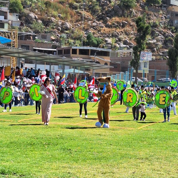 Community parade held in Mariano Melgar, Peru on sunny afternoon