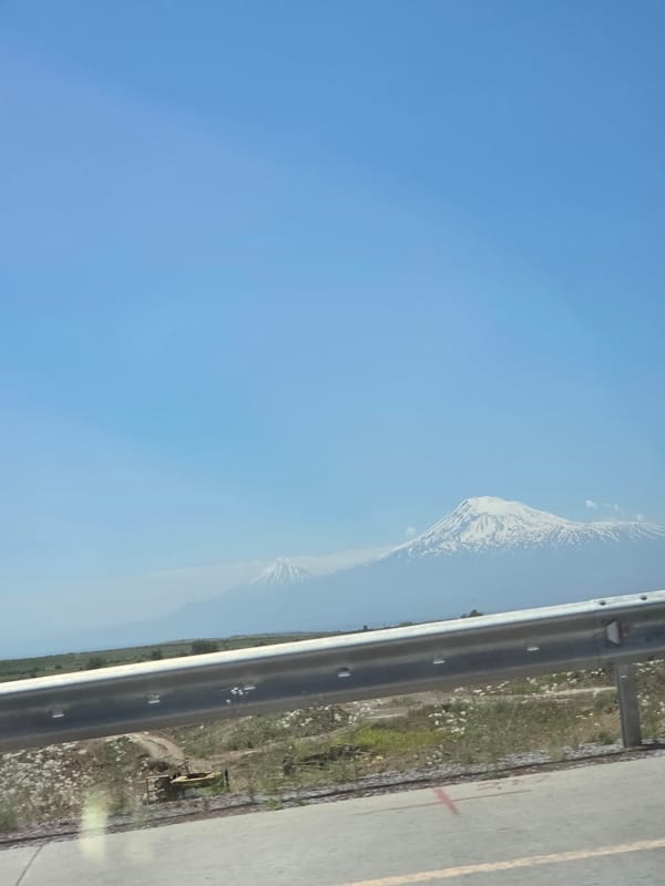 Clear sky landscape viewed from moving vehicle in Armenia