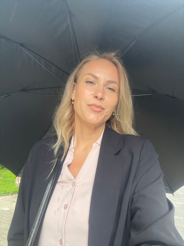 Woman with umbrella visits naval monuments during rain in Sochi