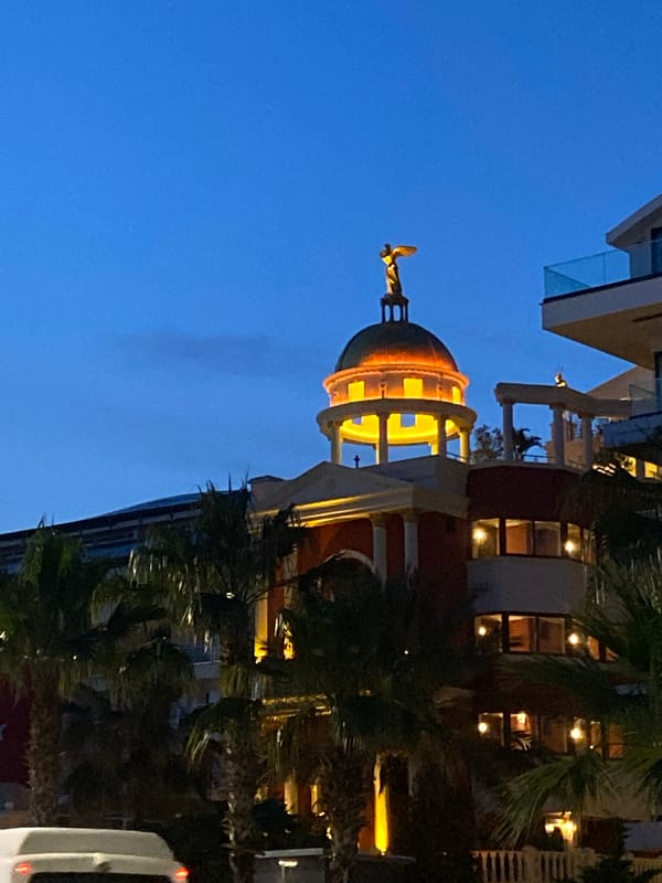 Nighttime scenes captured in Alanya featuring illuminated dome, beach at dusk