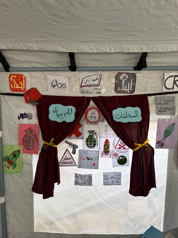 Handmade conflict-themed drawings displayed in Gaza temporary structure