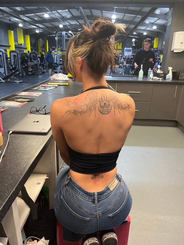 Woman with tattoo spotted at gym desk in Tunbridge Wells