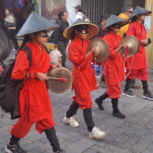 Chinese dragon dance procession performs in Arequipa Peru streets