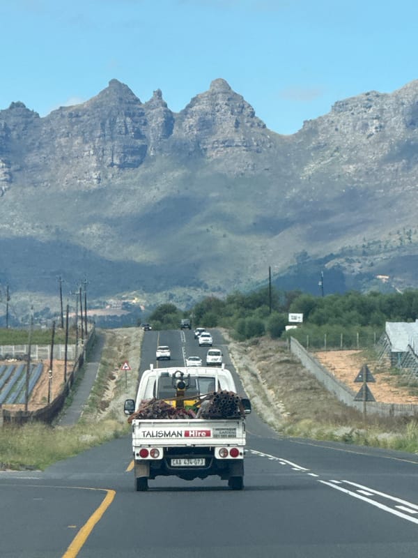 Talisman Hire truck travels mountain road in Stellenbosch