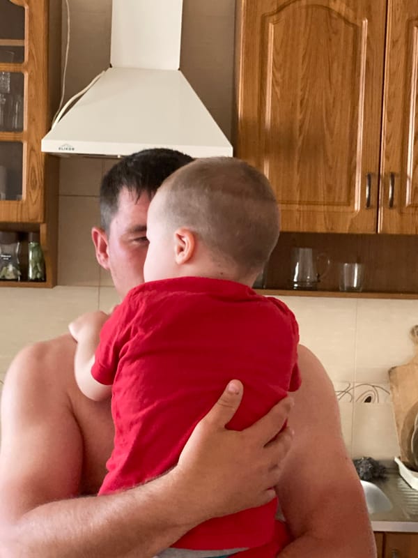 Father and child's playful moments captured in Sochi home