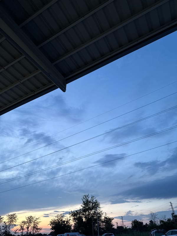 Sunset observed over Plovdiv parking area with delivery vehicles