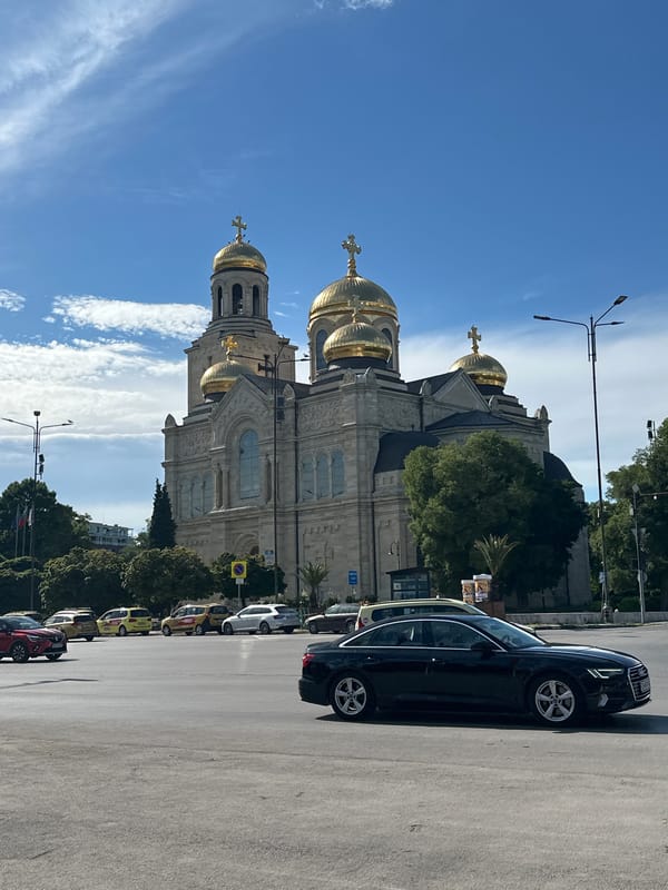 Driving past a golden-domed cathedral on an afternoon trip
