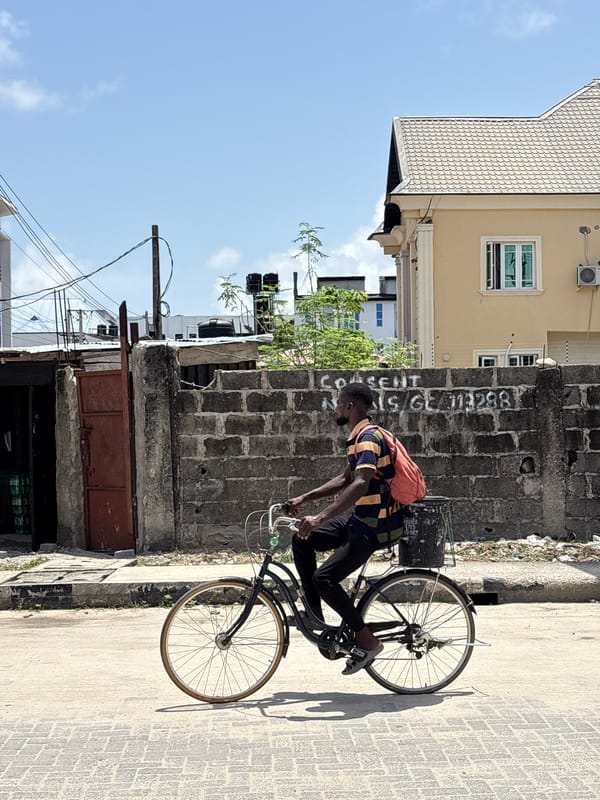 Man on bicycle observed in Igboefon, Nigeria street scene