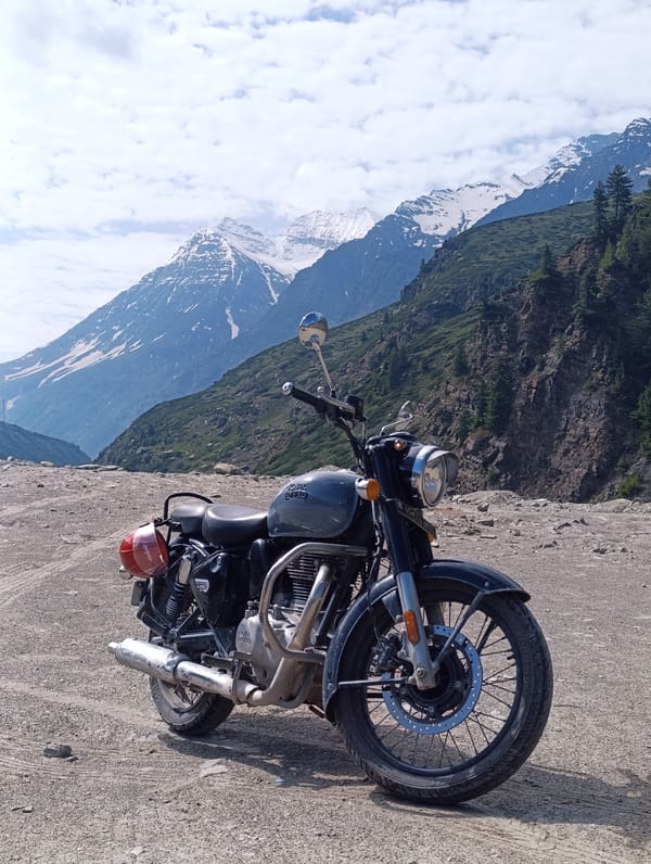 Royal Enfield parked mid-ride through Lahaul Valley, Sissu