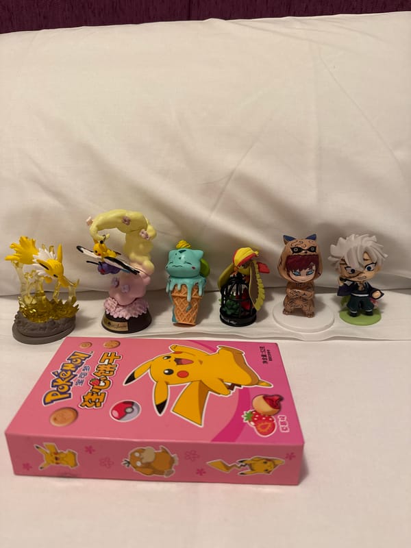 Figurine collection arranged on white surface in Madrid home