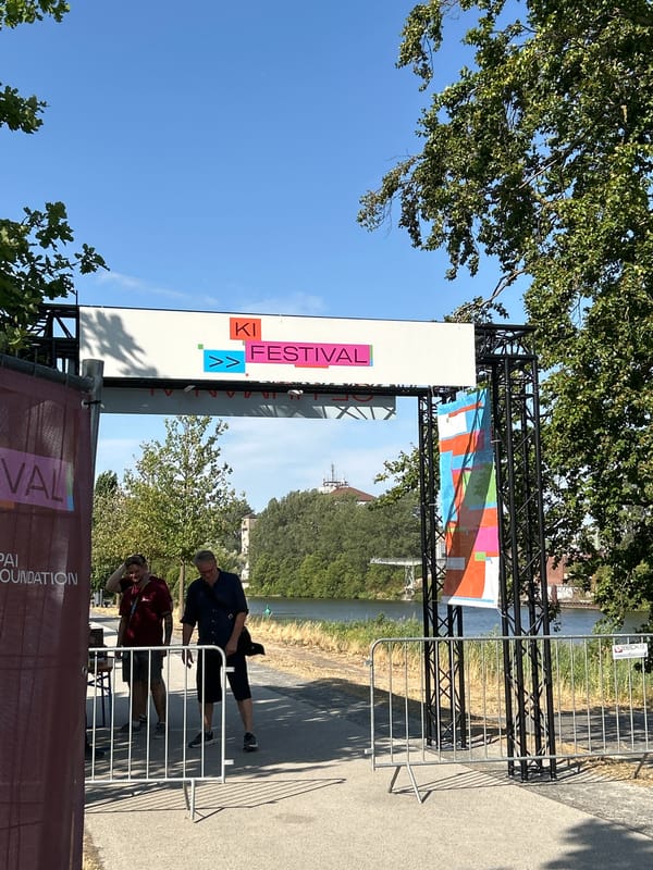 KI Festival grounds on a sunny day, tents and vintage photo van
