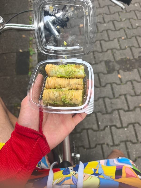 Person displays pistachio baklava in Hattersheim, Germany