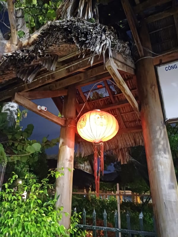 Nha Trang venue entrance glows with lanterns and blue pillars at night