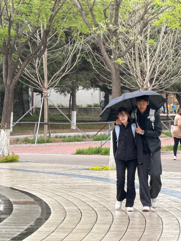 Rainy morning brings umbrellas to streets of Zhongtun, Guta