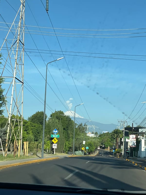 Street views captured in Puebla with Popocatépetl volcano backdrop