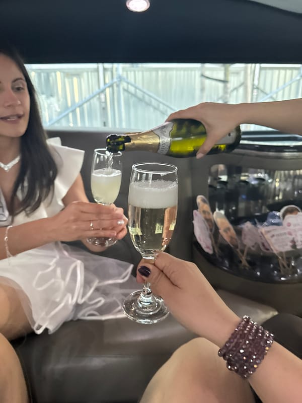 Bride-to-be celebrates with champagne near Sofia cathedral