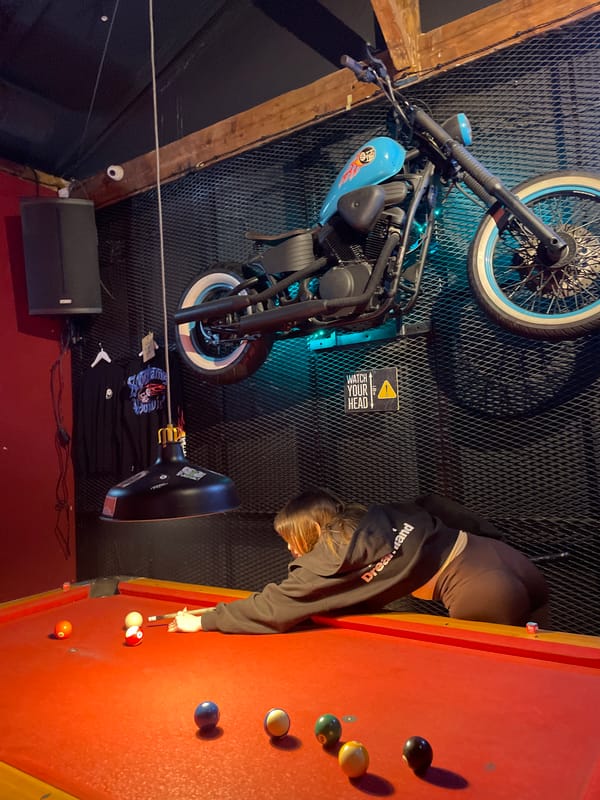 Pool player enjoys motorcycle-themed bar in Belgrade