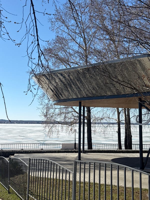 Spring morning stroll captured along frozen Votkinsk Reservoir waterfront