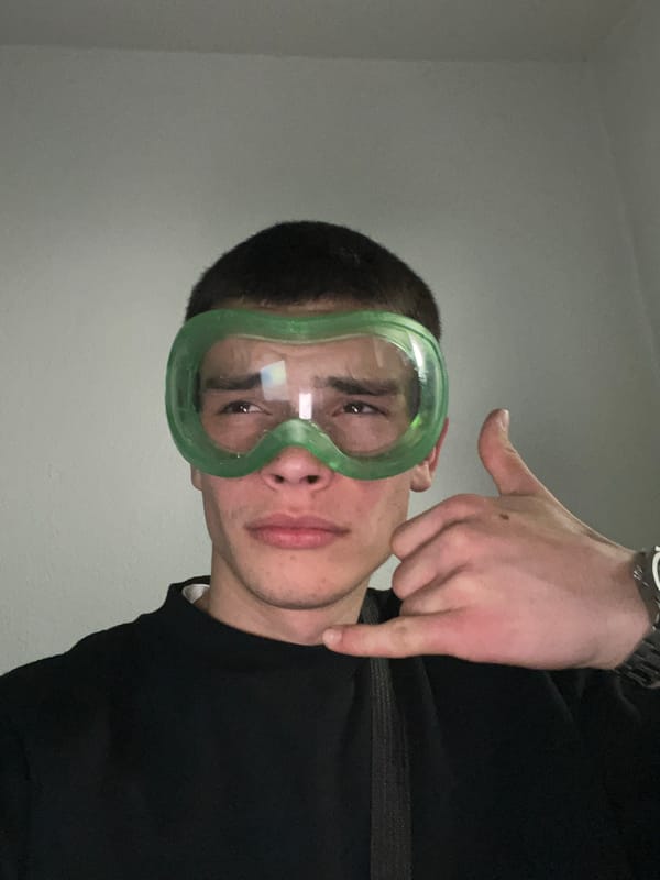 Person in green goggles takes selfies in Karavelovo