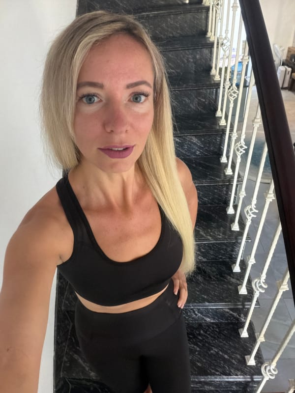 Posed on a marble staircase in Đà Lạt, Vietnam