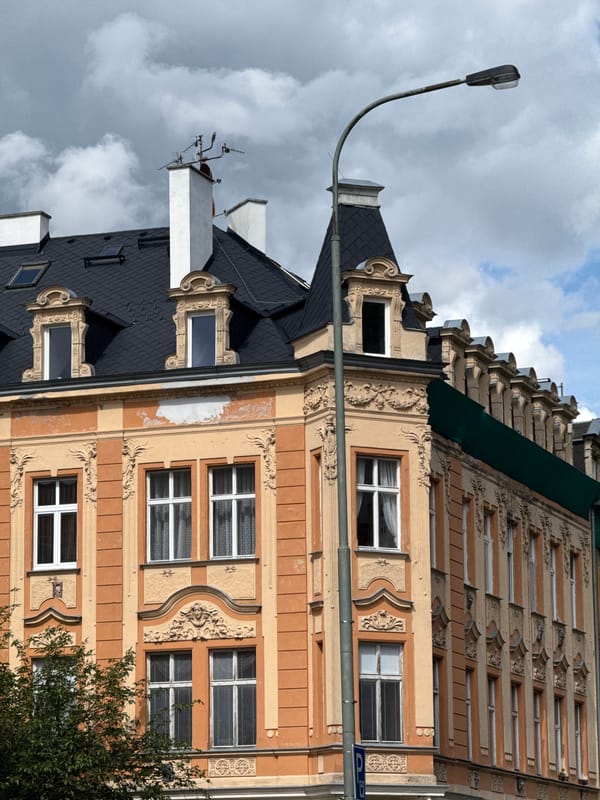 Tourist documents historic Karlovy Vary architecture during afternoon walk
