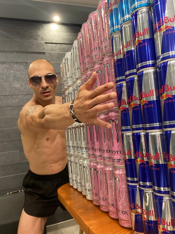 Man poses with energy drinks and accordion in Bulgaria