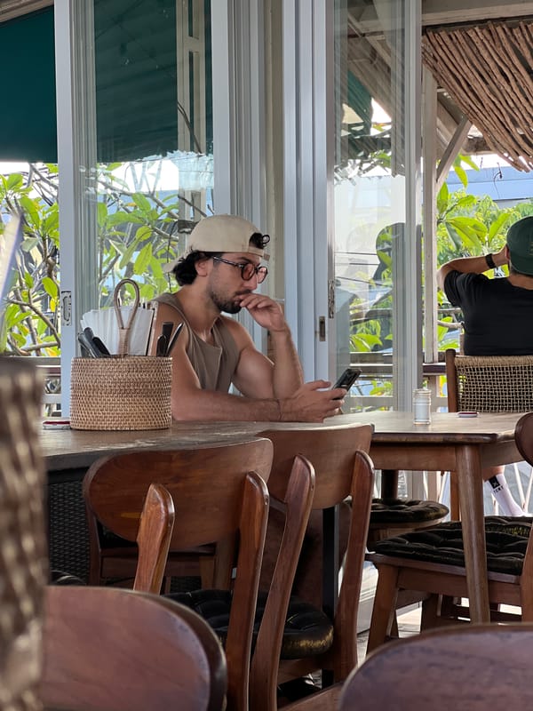 Morning moments captured in North Kuta: phone user, bonsai collection