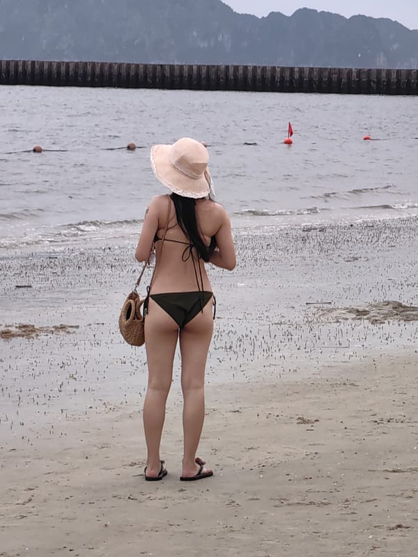 Tourists enjoy beach activities at Vietnam coastal resort