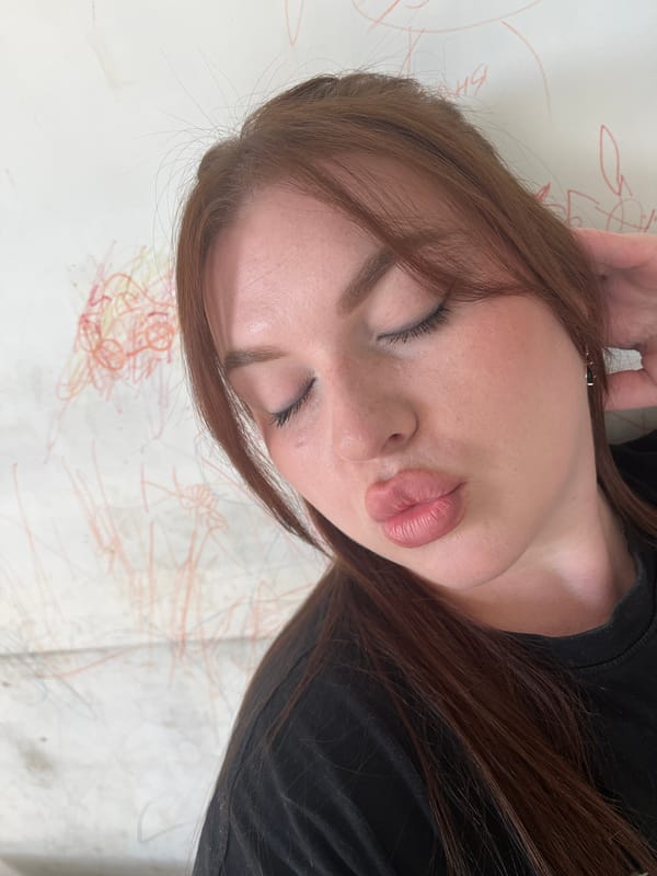 Woman photographs herself in morning selfie session in Pavlovka