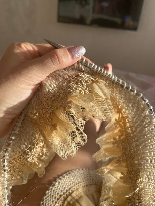 Person knits decorative beige fabric in Nizhny Novgorod