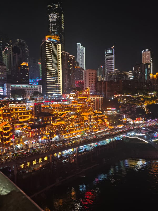 Illuminated Hongyadong attraction draws evening visitors in Chongqing