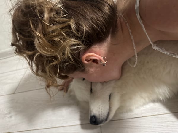Woman and white Samoyed dog captured in intimate moments