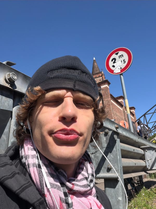Tourists photograph themselves around Milan's Navigli canal district