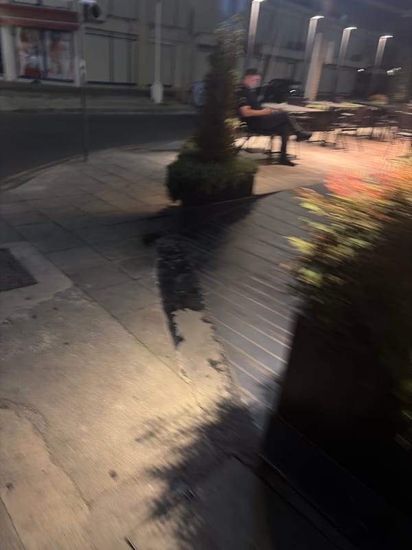 Foggy night across Limassol streets, construction sites, and storefronts