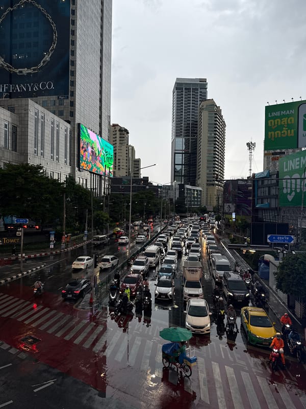 Bangkok traffic grinds through a rainy morning commute