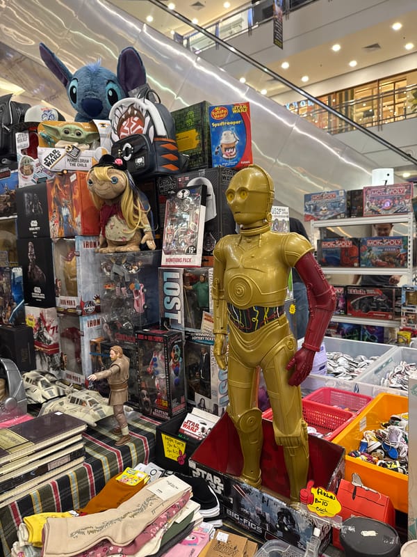 Pop culture collectibles and home decor stalls fill a KL indoor market