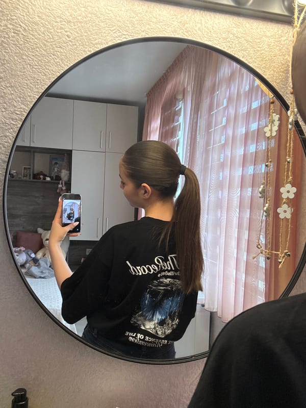 Woman takes mirror selfie in Bulgarian village